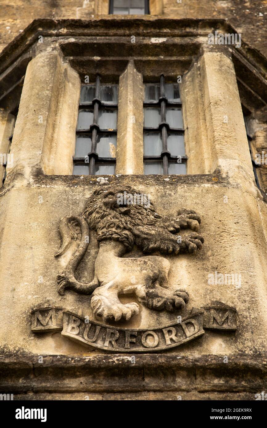 UK, England, Oxfordshire, Burford, High Street, Falkland House, old carved stone lion emblem below bay window Stock Photo
