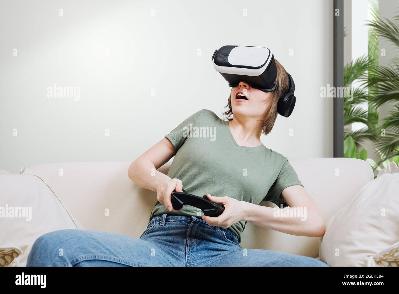 Excited Attractive Woman Gaming With Virtual Reality Headset Or Goggles
