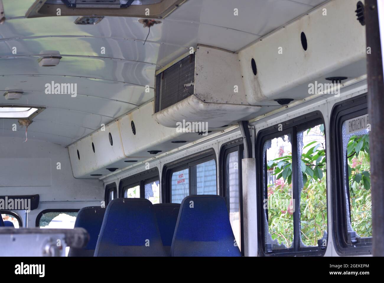 Dilapidated and rusty bus with broken windows in a remote area Stock ...