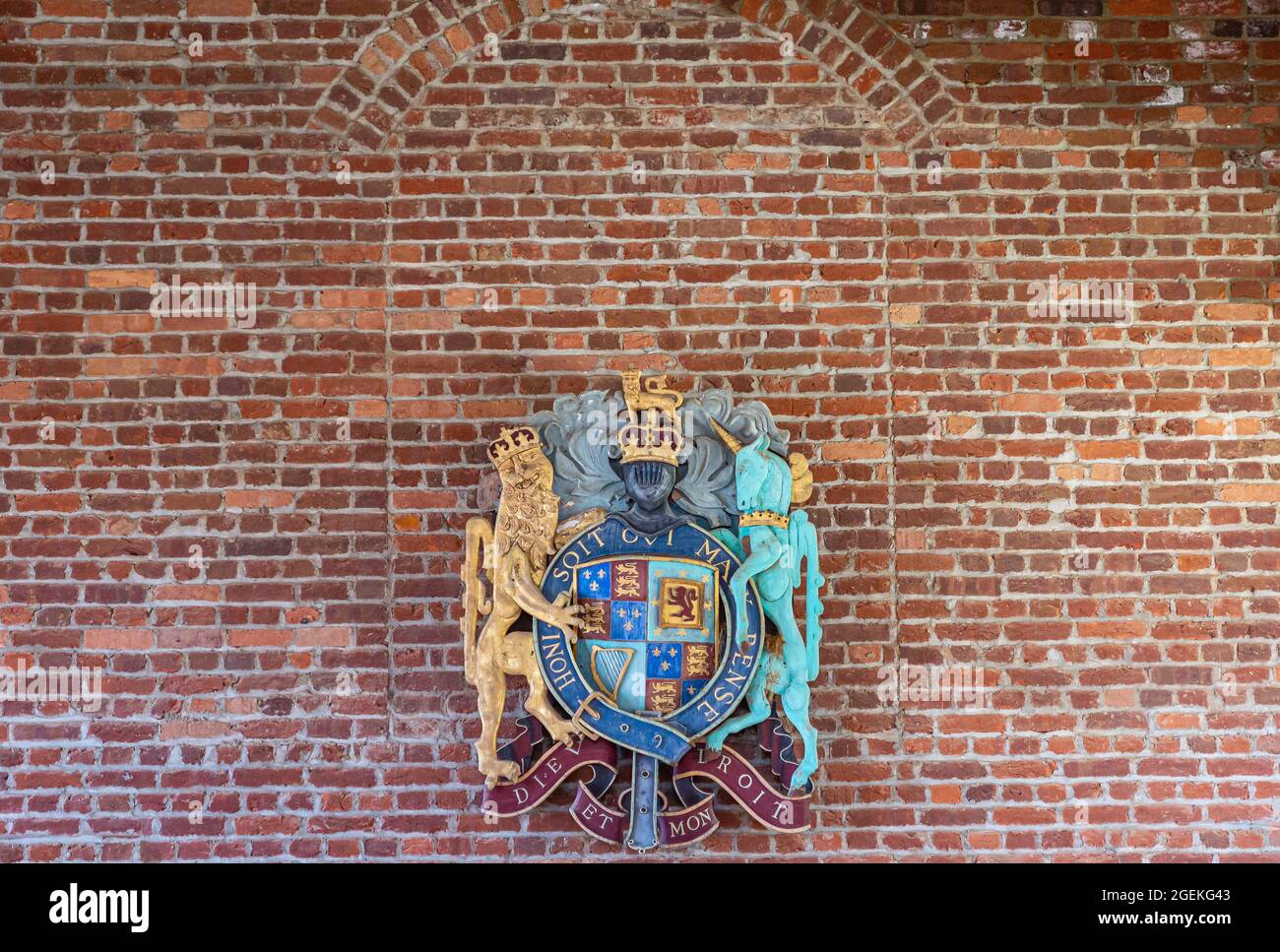 Jamestowne, VA, USA - April 1, 2013: Historic site. English Royal Coat of Arms against red brick wall. Motto is Dieu et mon Droit. Stock Photo