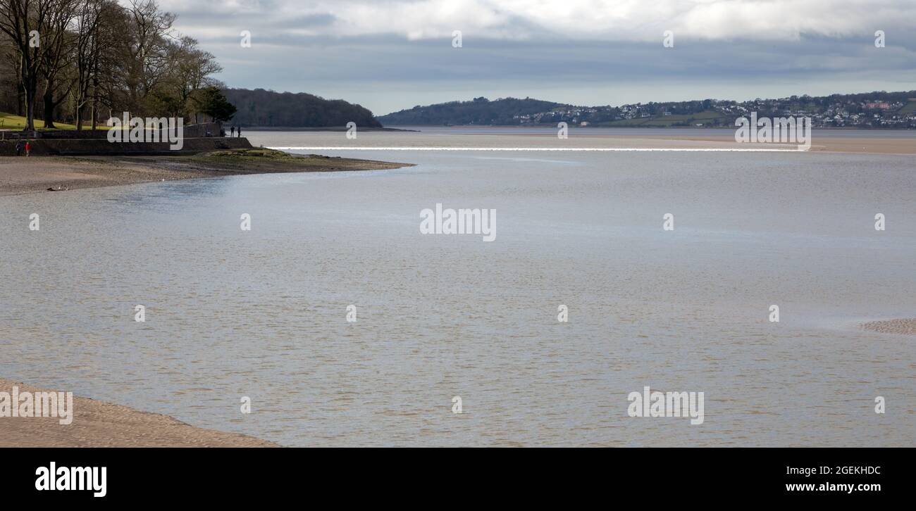 The Arnside Bore, a spectacular wave that travels inland on the highest tides, approaching the village of Arnside in Cumbria Stock Photo