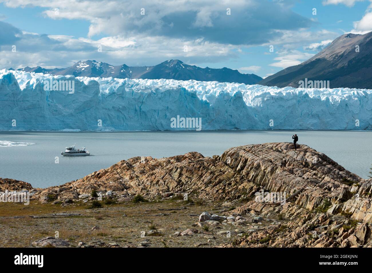 A man on the rock, Perito Moreno Glacier Stock Photo