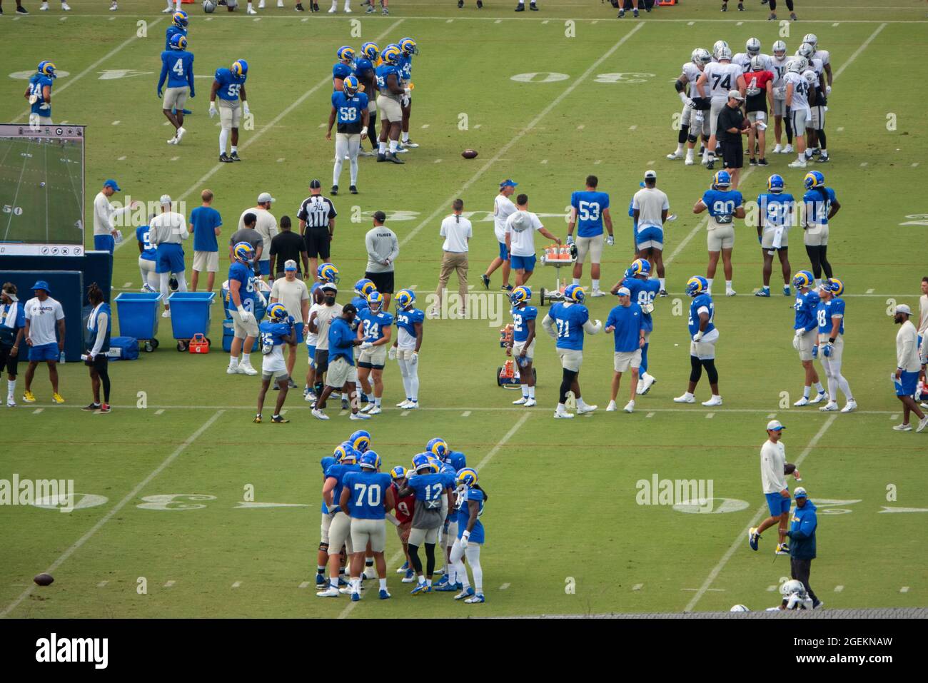 Thousand Oaks, California, USA. 19th Aug, 2021. The Los Angeles Rams and the Las Vegas Raiders held a joint practice at the Rams training facility at California Lutheran University. Here, Rams quarterback Matthew Stafford, in red jersey, bottom right, and Raiders quarterback, Derek Carr, above, run plays on separate fields. (Credit Image: © K.C. Alfred/ZUMA Press Wire) Stock Photo