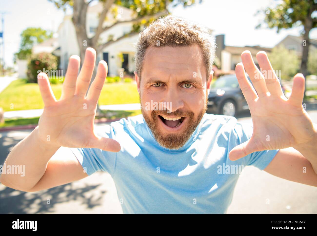 happy man outdoor. express positive emotions. smiling man with beard. male closeup face portrait. Stock Photo