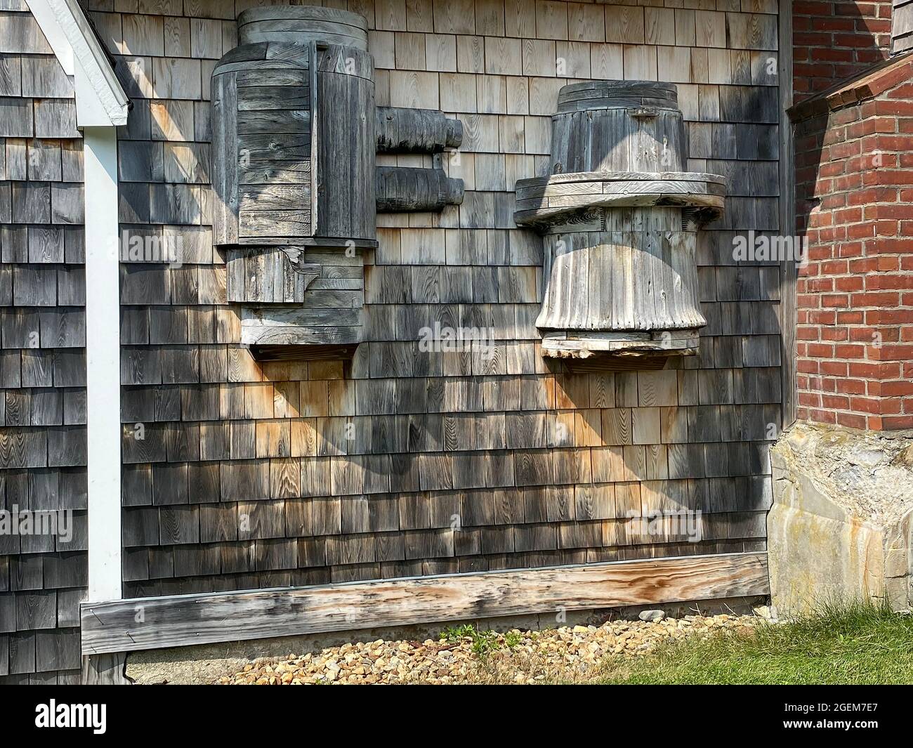 This sculpture—Wooden Barrel-type structures attached to house— was done by American artist Bernard Langlais and is housed at the Langlais Sculpture Preserve in Cushing, Maine. Bernard Langlais (1921 - 1977) was a Maine native and maintained a studio in Cushing, Maine until his death at the age of 56. He developed his artistic interest at the Corcoran School of Art in Washington DC and the Skowhegan School of Painting and Sculpture. Stock Photo