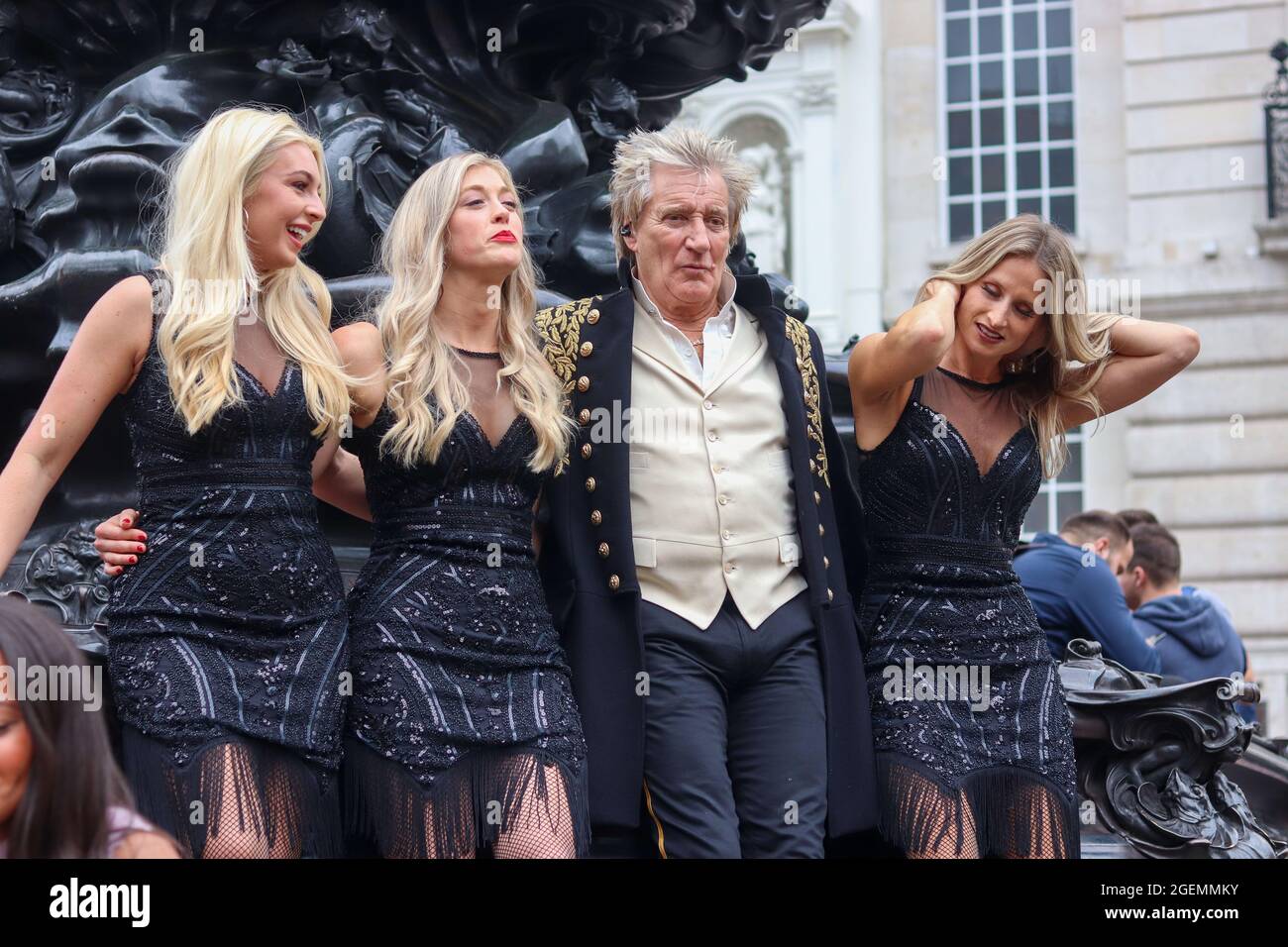 London, UK. 20th Aug, 2021.  Musician Rod Stewart films music video on the Shaftesbury Memorial Fountain 'Eros' Statue in Piccadilly Circus Credit: Lucy North/Alamy Live News Stock Photo