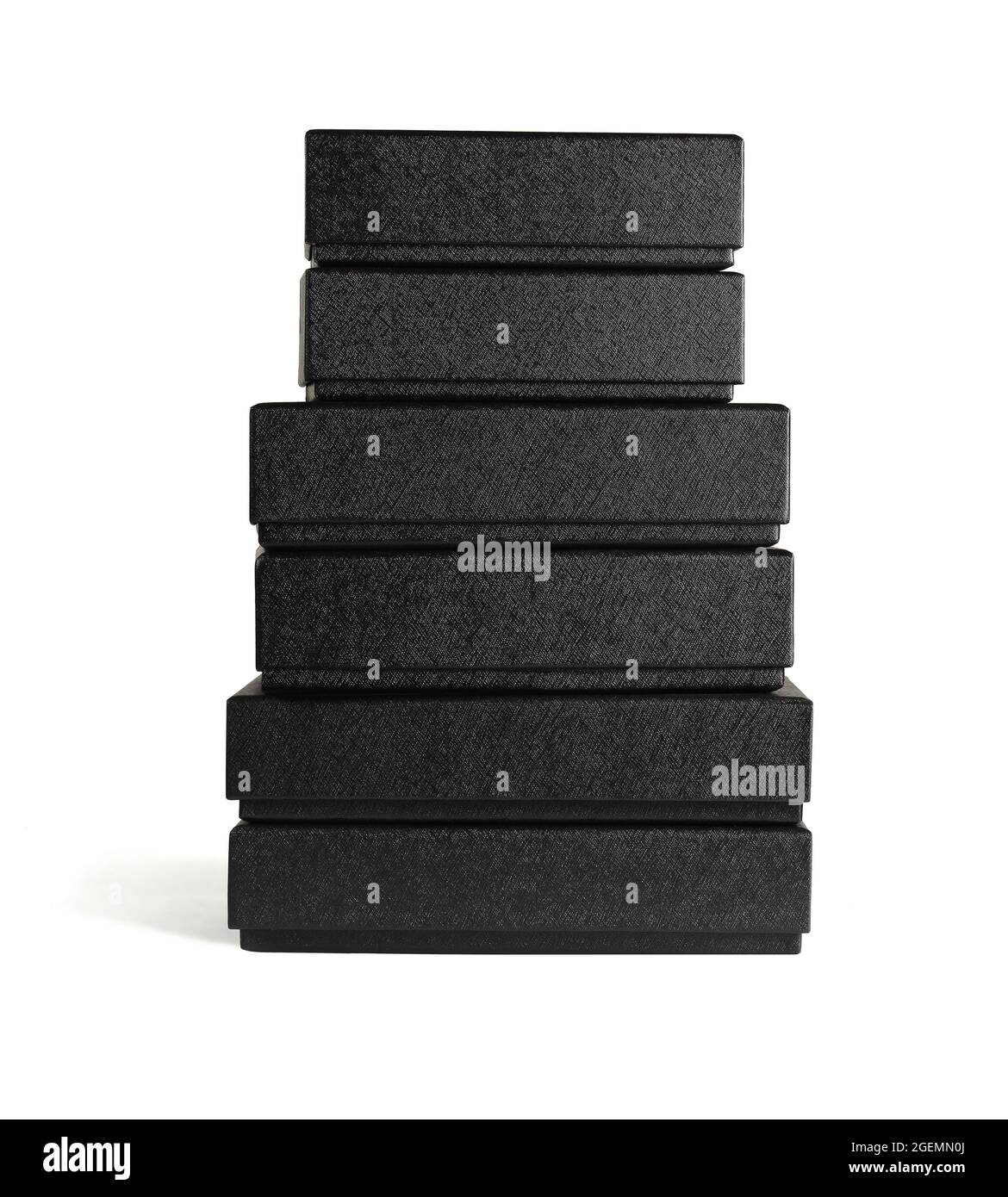 Stack of Assorted Black Cardboard Boxes on White Bakground Stock Photo