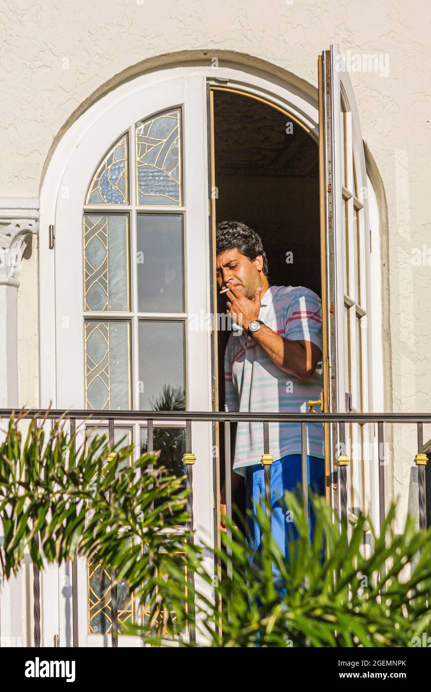 Miami Beach Florida,Ocean Drive,Casa Casuarina,Gianni Versace House mansion  window balcony man smoking Stock Photo - Alamy