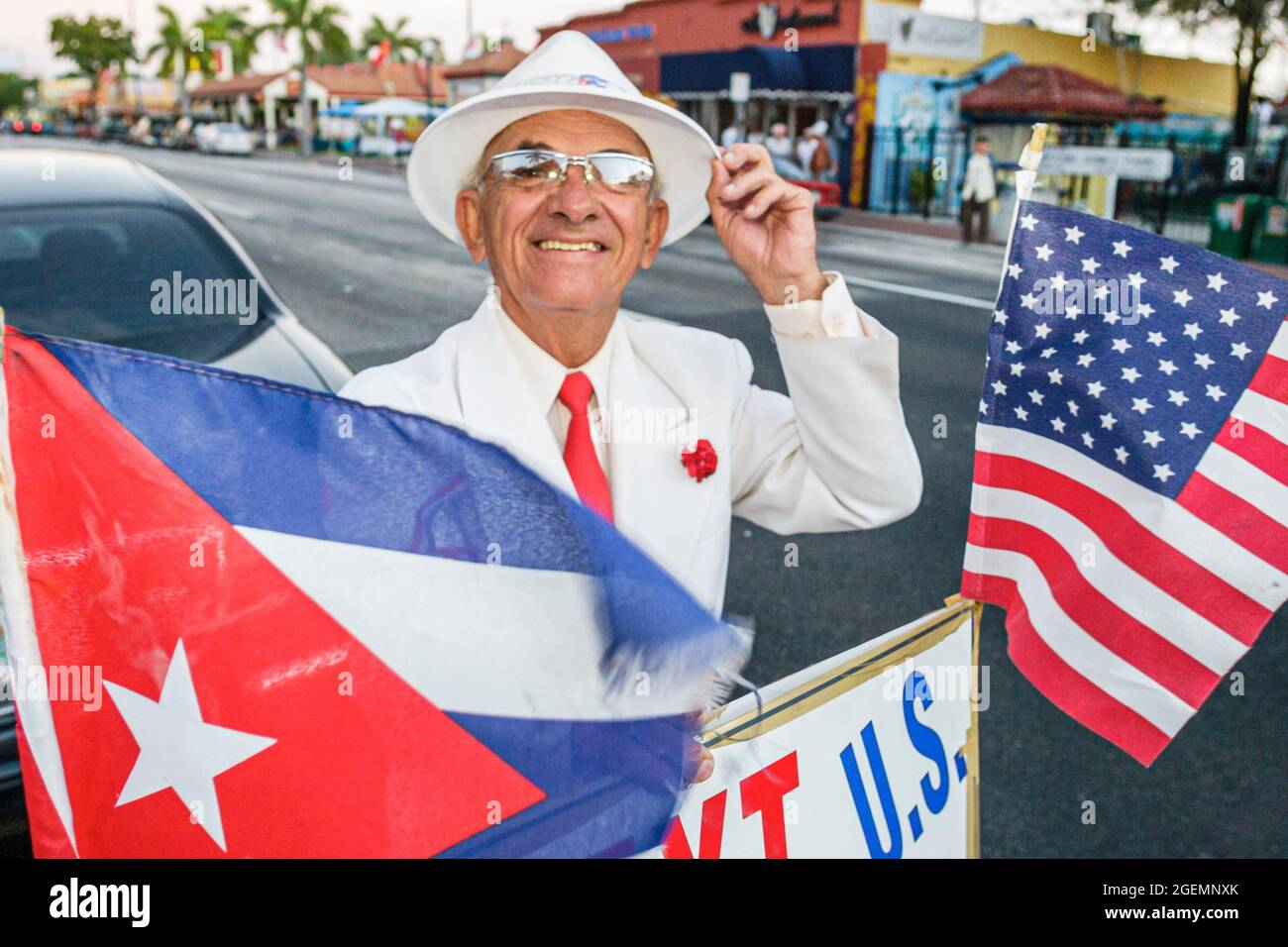 Miami Florida,Little Havana,Calle Ocho,Cuban Hispanic senior citizen man male flags wearing white suit, Stock Photo