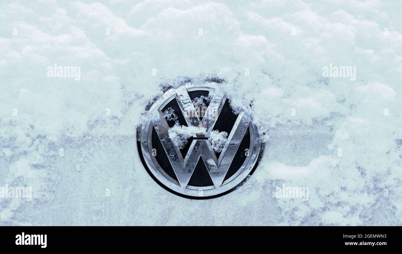 Close-up of A Snow-capped VW Logo On A Car Stock Photo