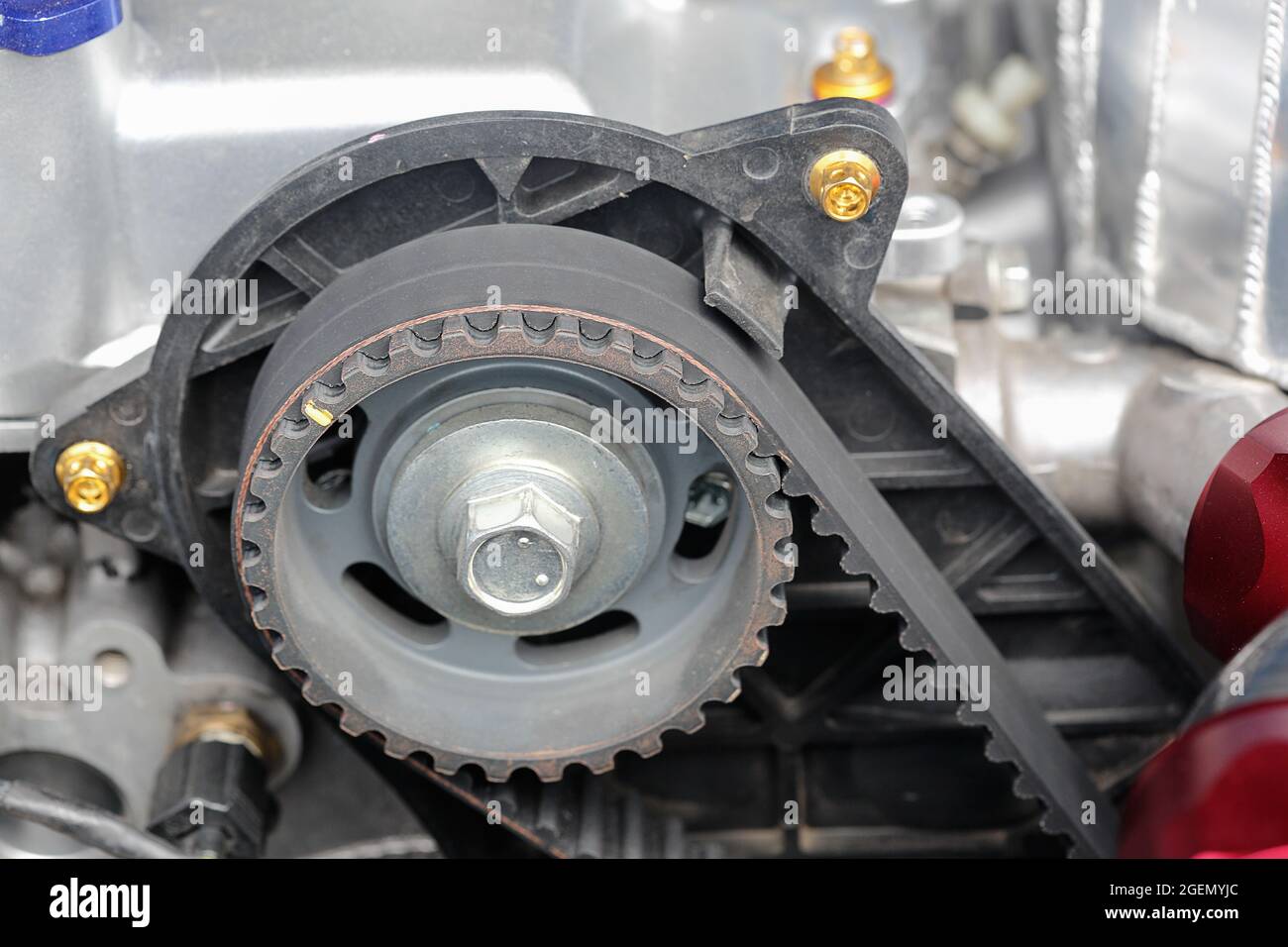 Timing belt and camshaft sprocket in car engine. Stock Photo