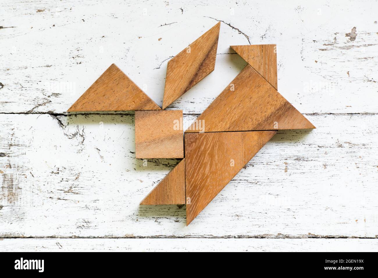 Tangram puzzle in jumping rabbit shape on old white wood background Stock  Photo - Alamy