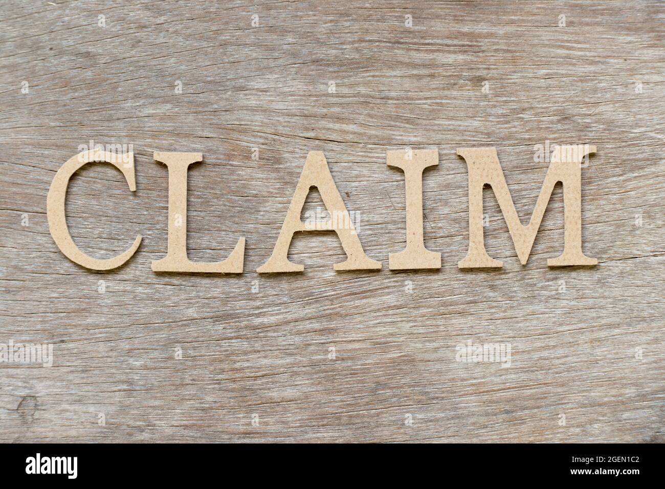 Alphabet letter in word claim on wood background Stock Photo - Alamy