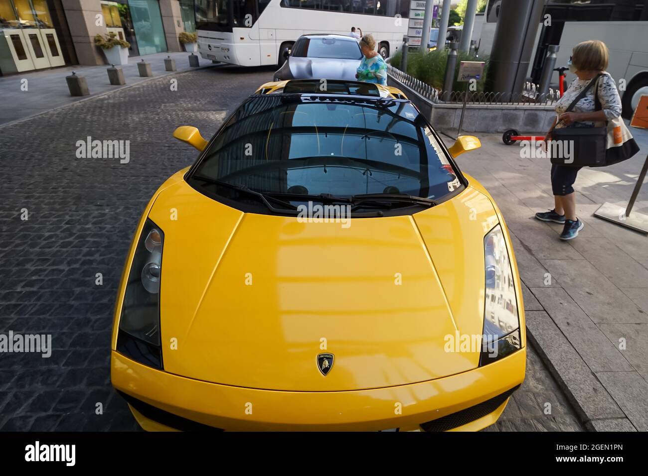 Bucharest, Romania - August 17, 2021: An yellow 2006 Lamborghini Gallardo Spyder is parked in front of the entrance to the Radisson Blu Hotel Buchares Stock Photo