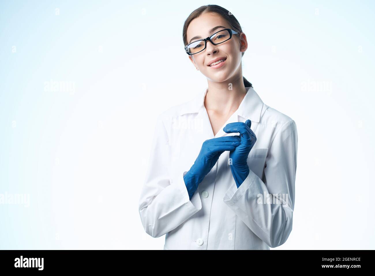 female doctor emix white coat follow light background Stock Photo - Alamy
