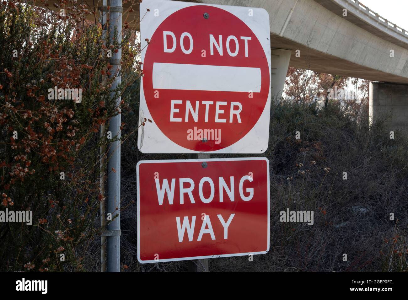 Wrong way sign at side of highway hi-res stock photography