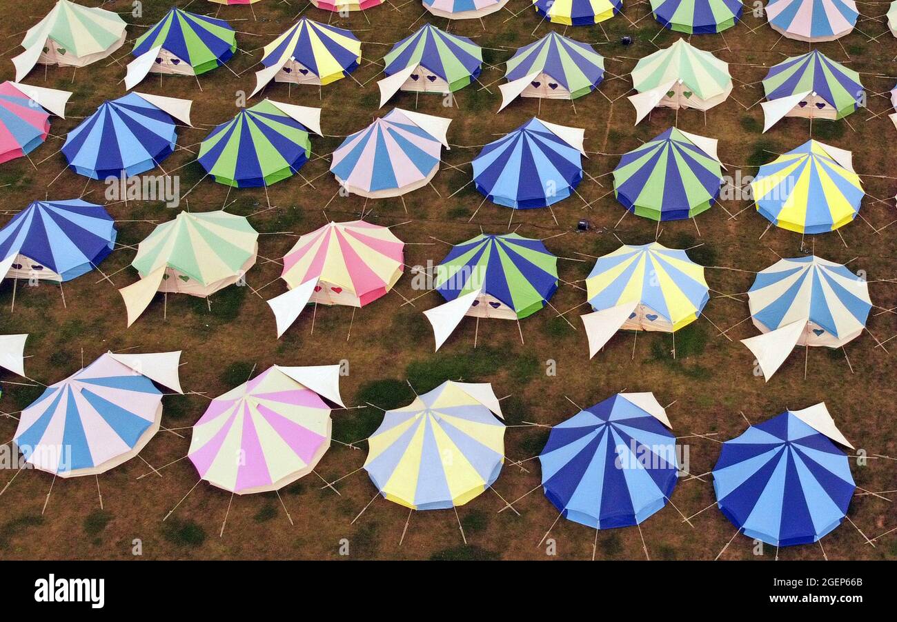 Abbots Ripton, UK. 19th Aug, 2021. It's the first day of the We Out Here festival at Abbots Ripton near Huntingdon, Cambridgeshire, and lots of colourful tents can be seen with thousands of people expected to attend the festival. Credit: Paul Marriott/Alamy Live News Stock Photo