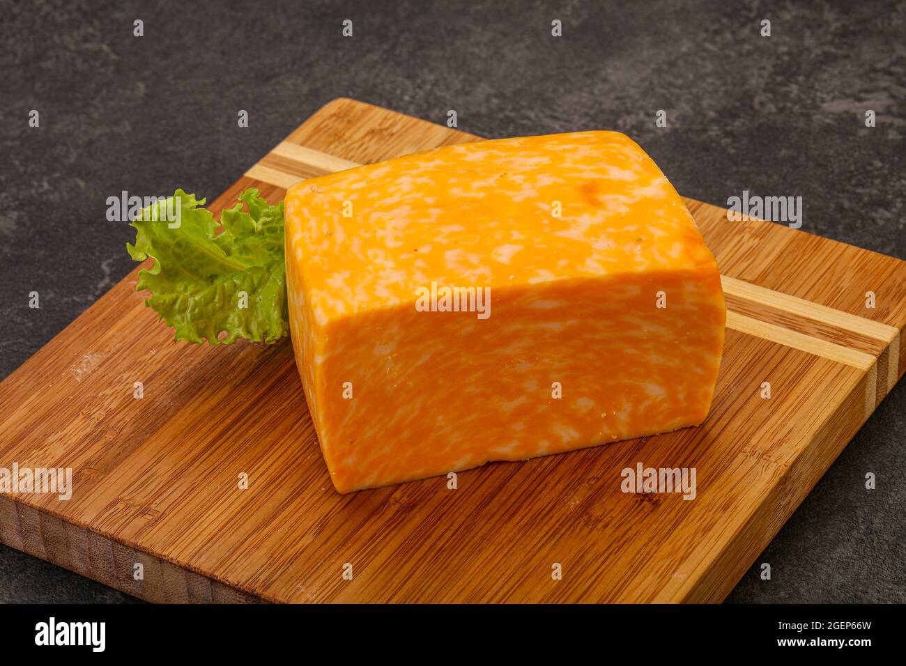 Dairy Marble cheese brick over board Stock Photo Alamy