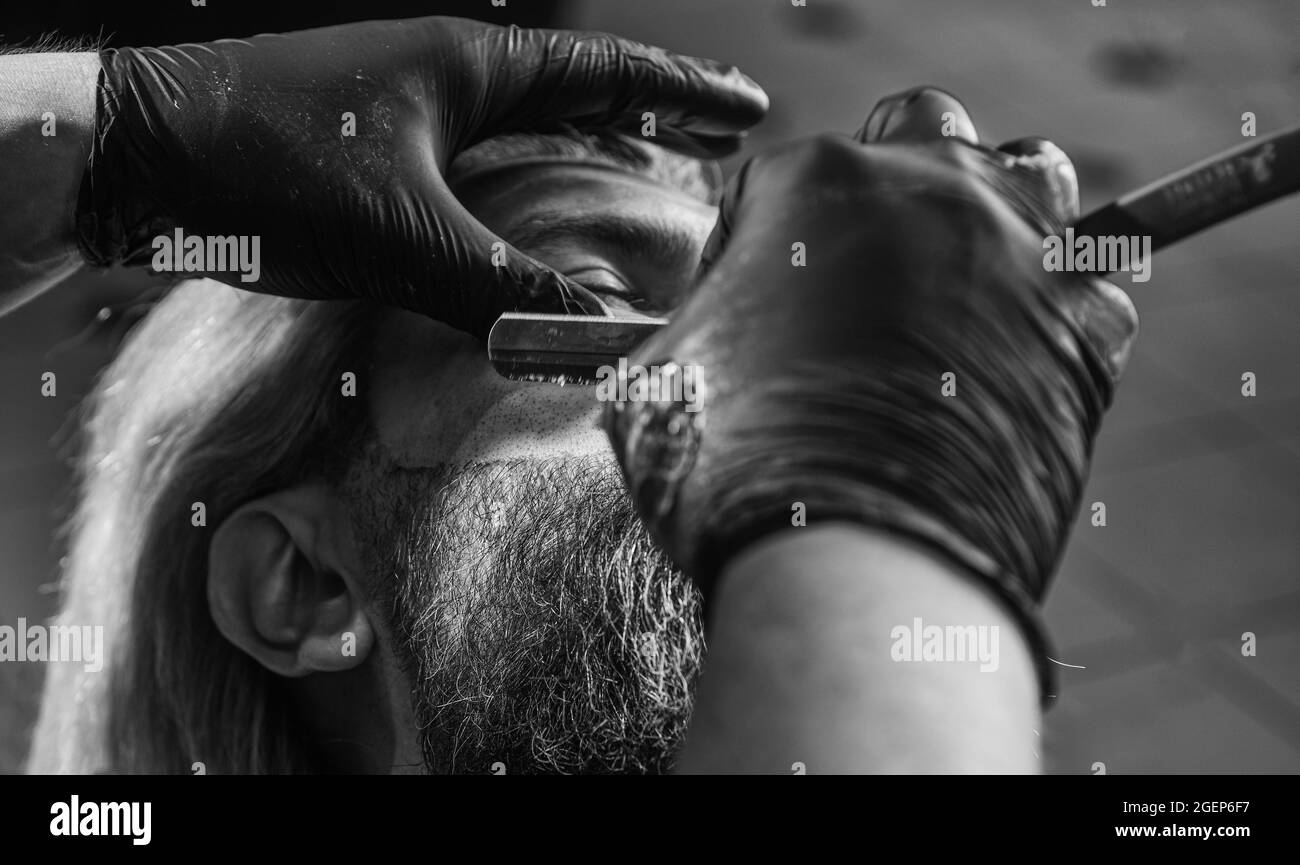 Shaving facial hair. Mastered craft from cutting hair every day. Visit