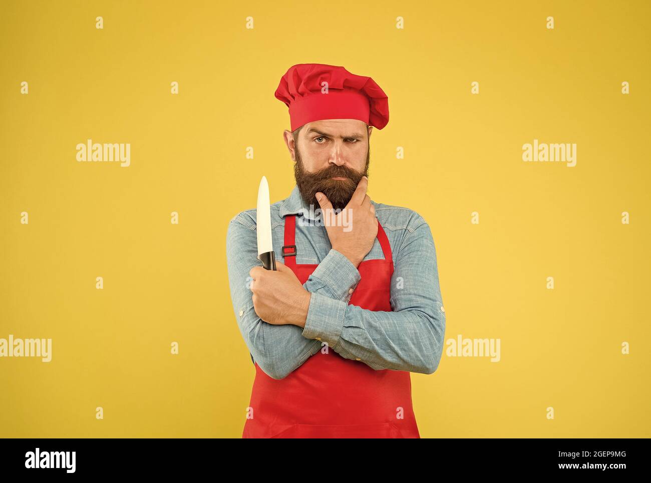 Excellent Cook Bearded chef knife serious hi-res stock photography and images - Alamy