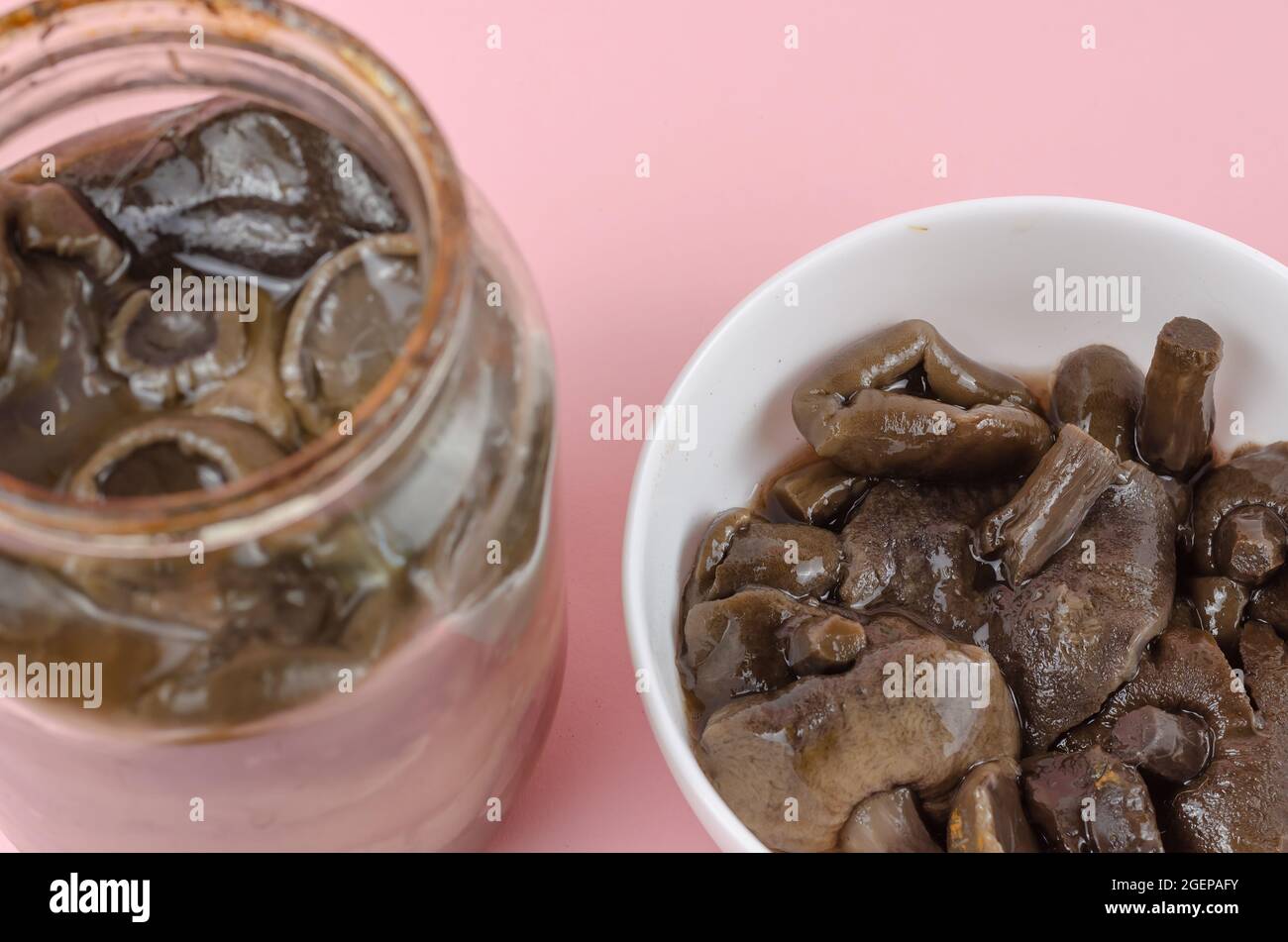 Botulism, food poisoning from canned foods concept. Glass jar and white