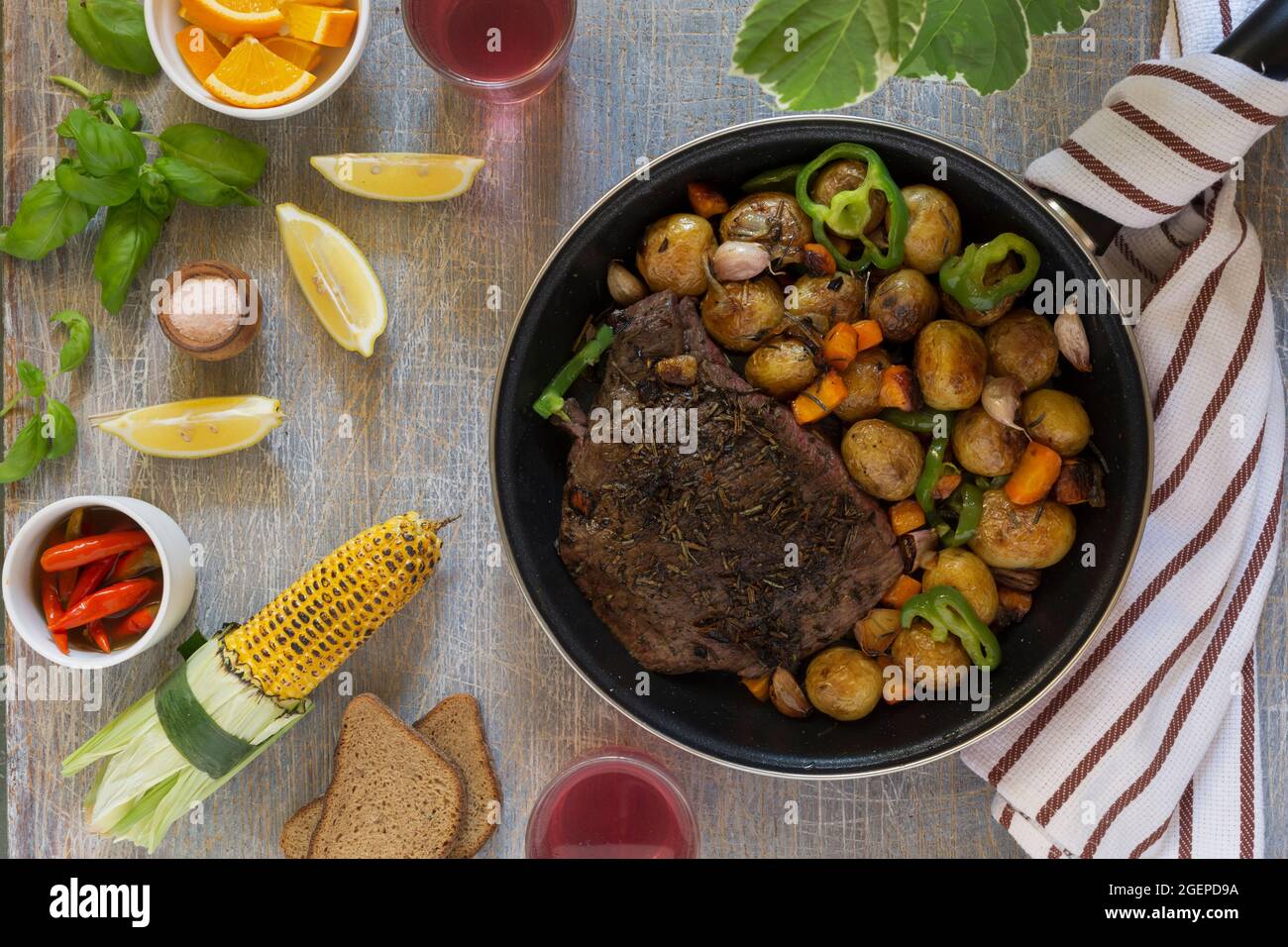 Traditional lunch American cooking grilled steak and various vegetables ...