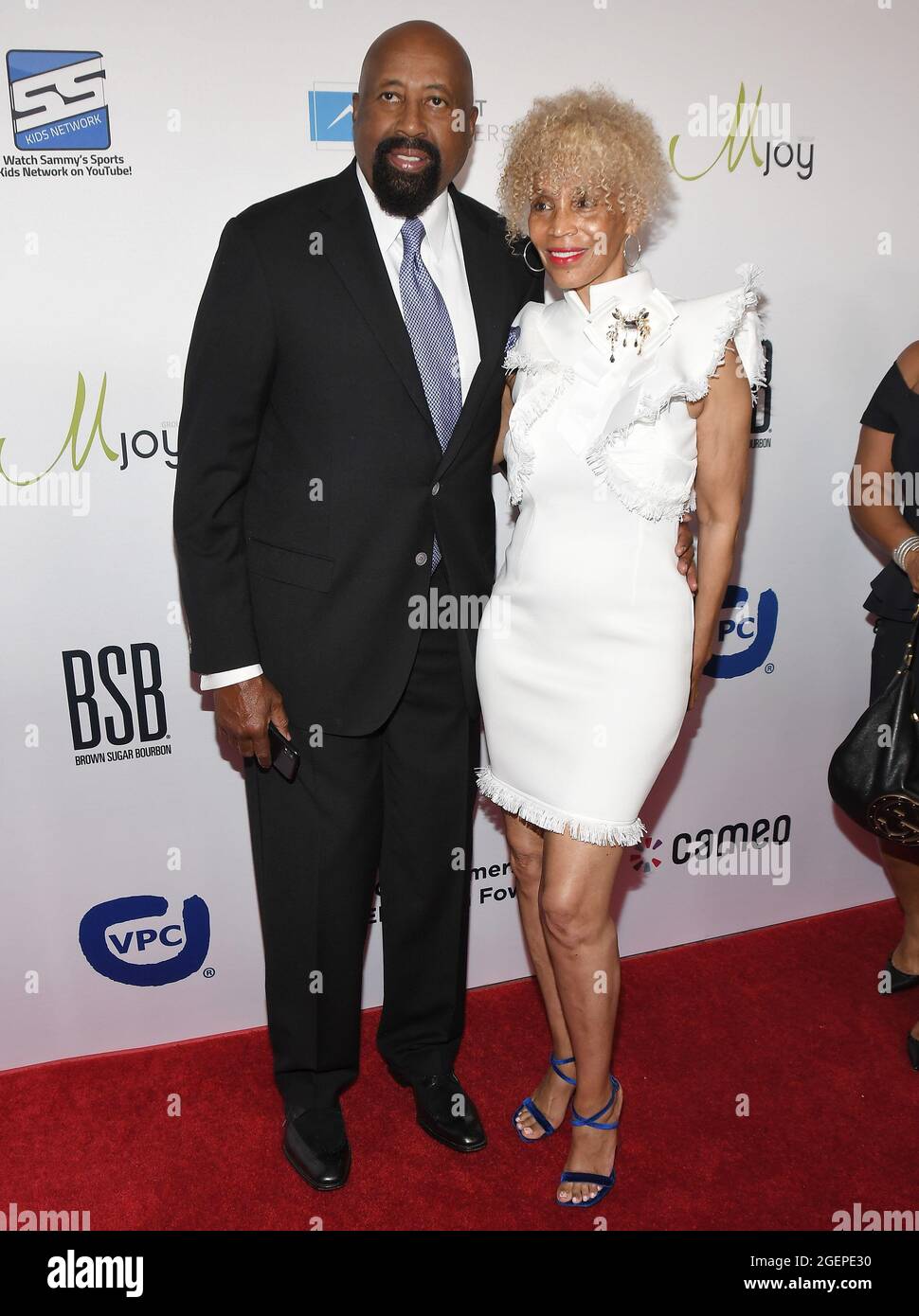 (LR) Mike Woodson and Terri Woodson arrives at the 21st Annual Harold