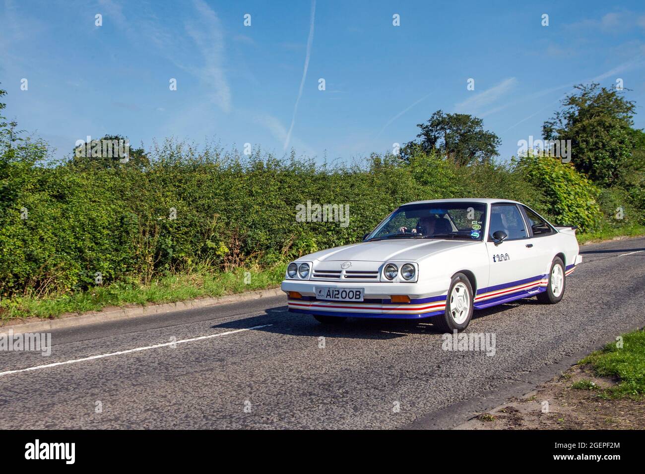 1984 80s eighties white Opel GTE Coupe 5 speed manual en-route to Capesthorne Hall classic July car show, Cheshire, UK Stock Photo