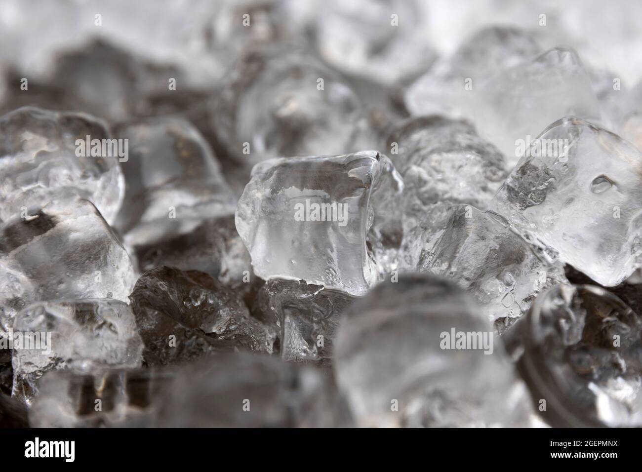 Ice cubes are seen melting. Macro shot. Stock Photo