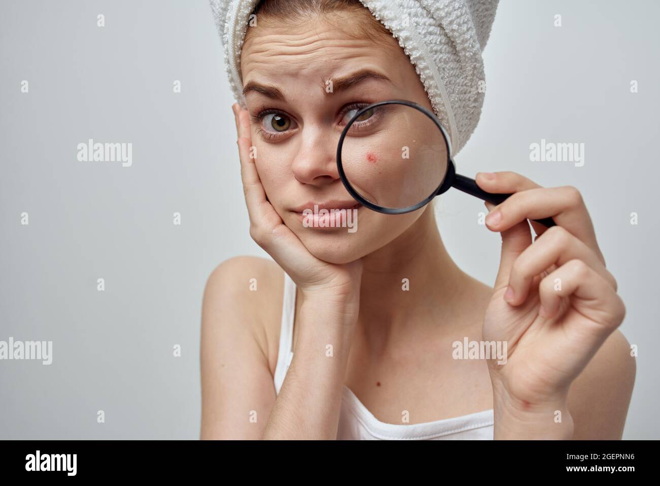 pretty woman with a magnifying glass in hand hygiene treatment Stock Photo Alamy