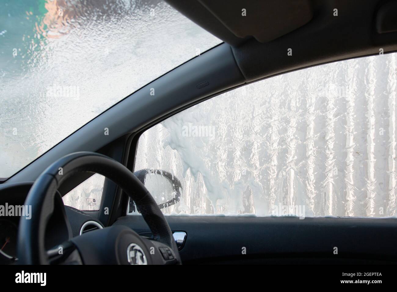 Cleaning a car in a hand car wash in the UK Stock Photo Alamy