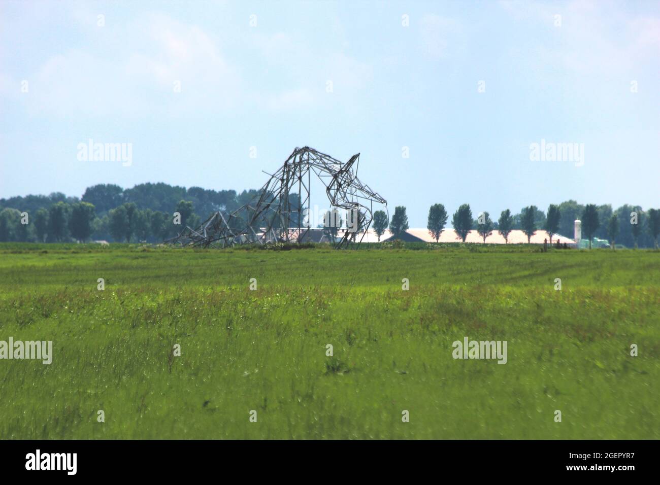 Broken powerlines and steel damage towers after downburst storm in Kerkdorp Oosterwolde in Netherlands Stock Photo