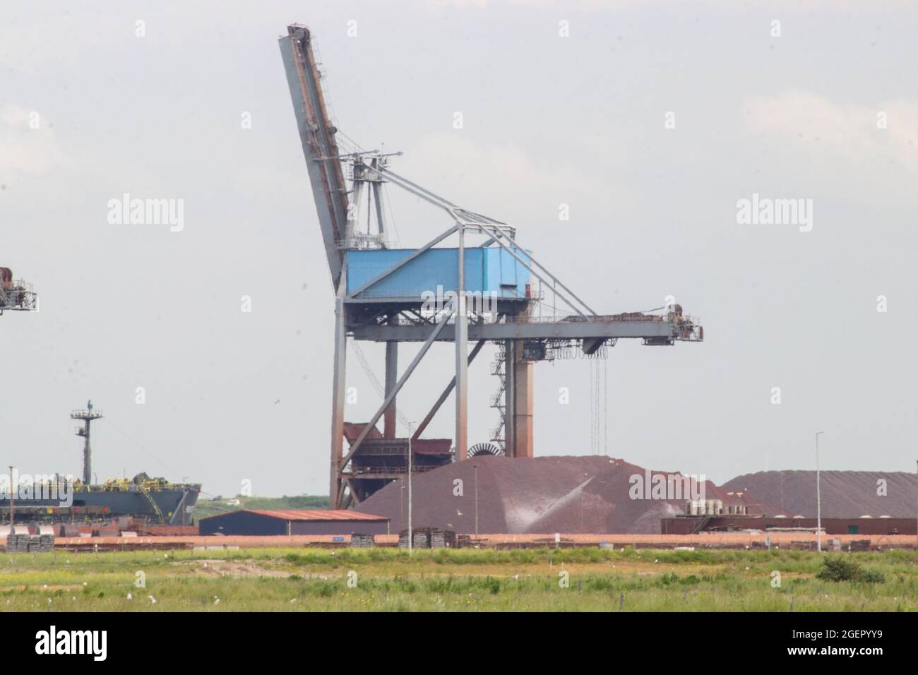 Ore transhipment company EECV with cranes in the Maasvlakte Harbor in Rotterdam Stock Photo