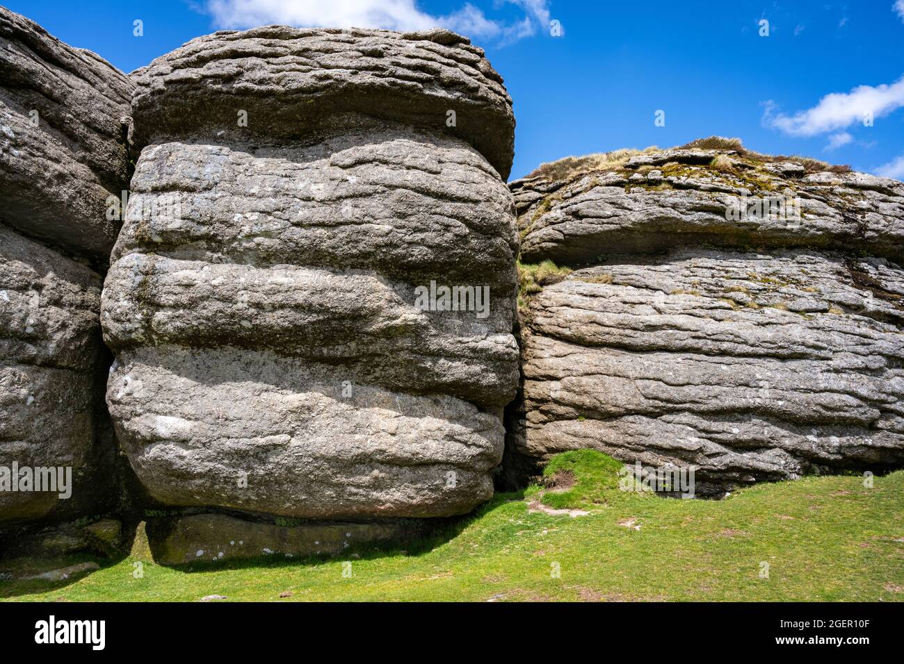 Saddle Tor is a classical avenue tor, with two main outcrops separated by an area of turf.  This is the northerly outcrop. Dartmoor, Devon, UK. Stock Photo