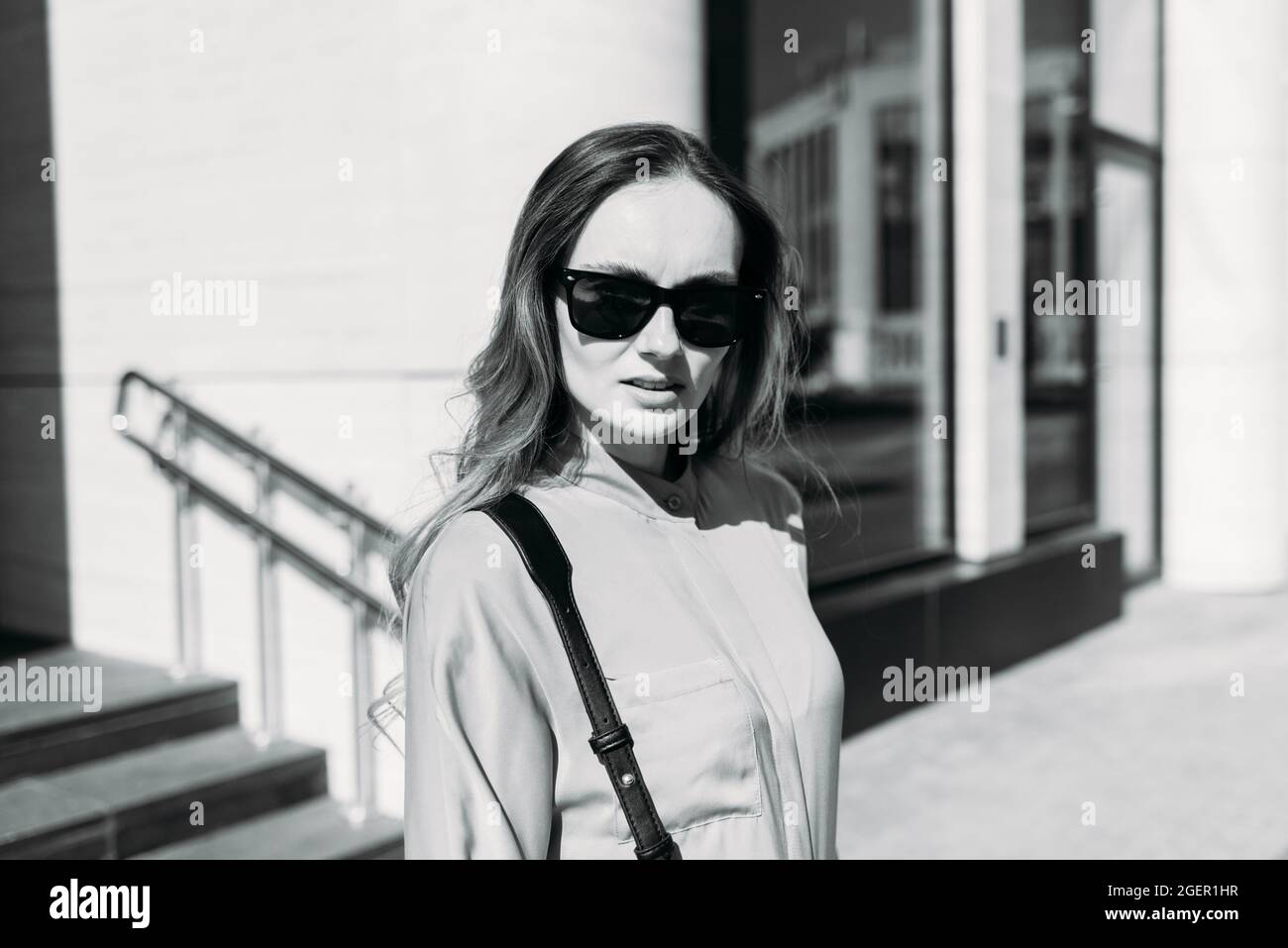 Caucasian girl looking at the camera and walking Stock Photo