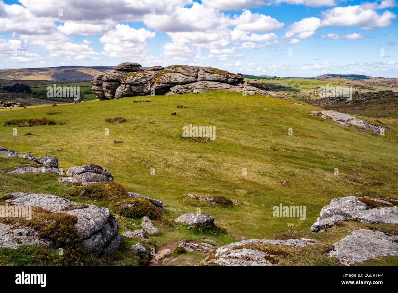 Saddle Tor is a classical avenue tor, with two main outcrops separated by an area of turf.  This is the northerly outcrop, seen from the southerly. Stock Photo