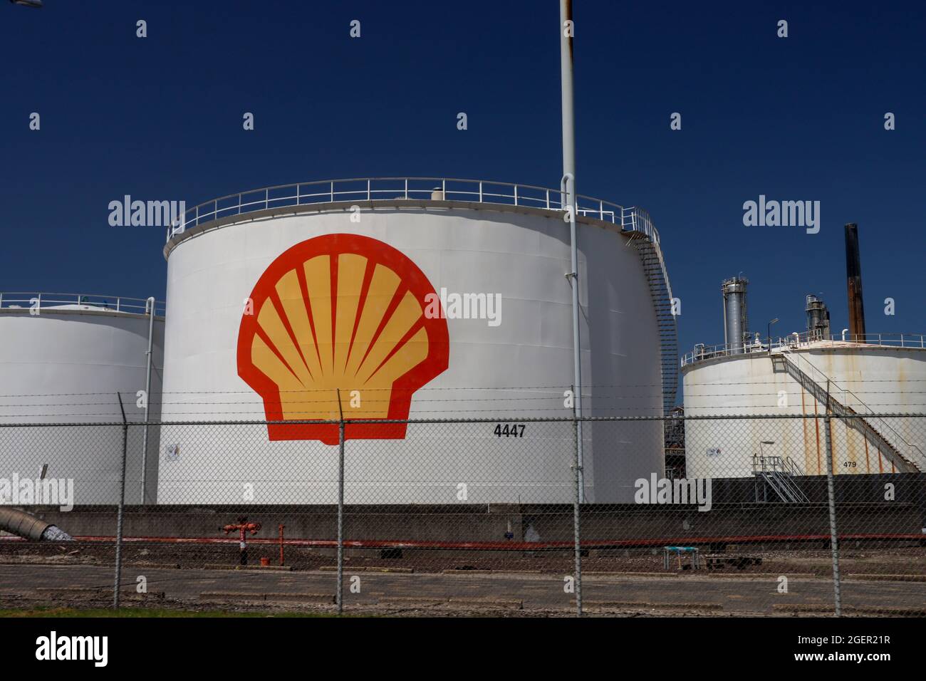 Oil storage tanks at the Shell refinery in the Pernis harbor in the port of Rotterdam Netherlands Stock Photo