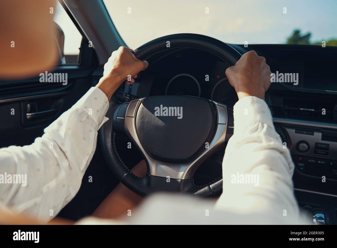Hand on steering wheel of expensive car Stock Photo Alamy