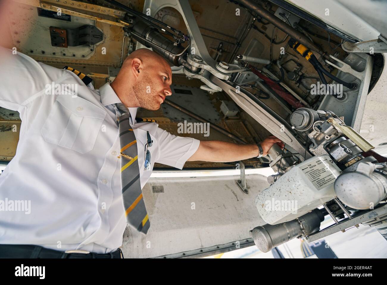 Airline captain inspecting an aircraft before the flight Stock Photo