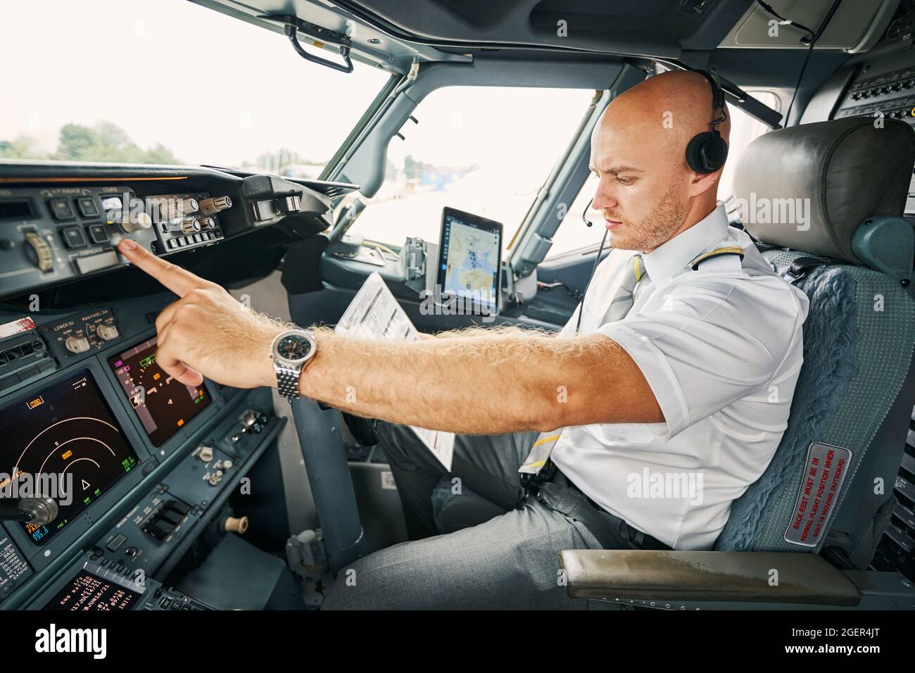 Experienced aviator checking flight controls before the departure Stock