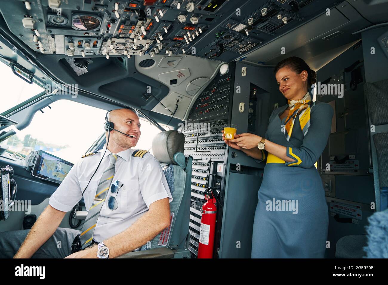 Female airline pilot in cockpit hi-res stock photography and images - Alamy