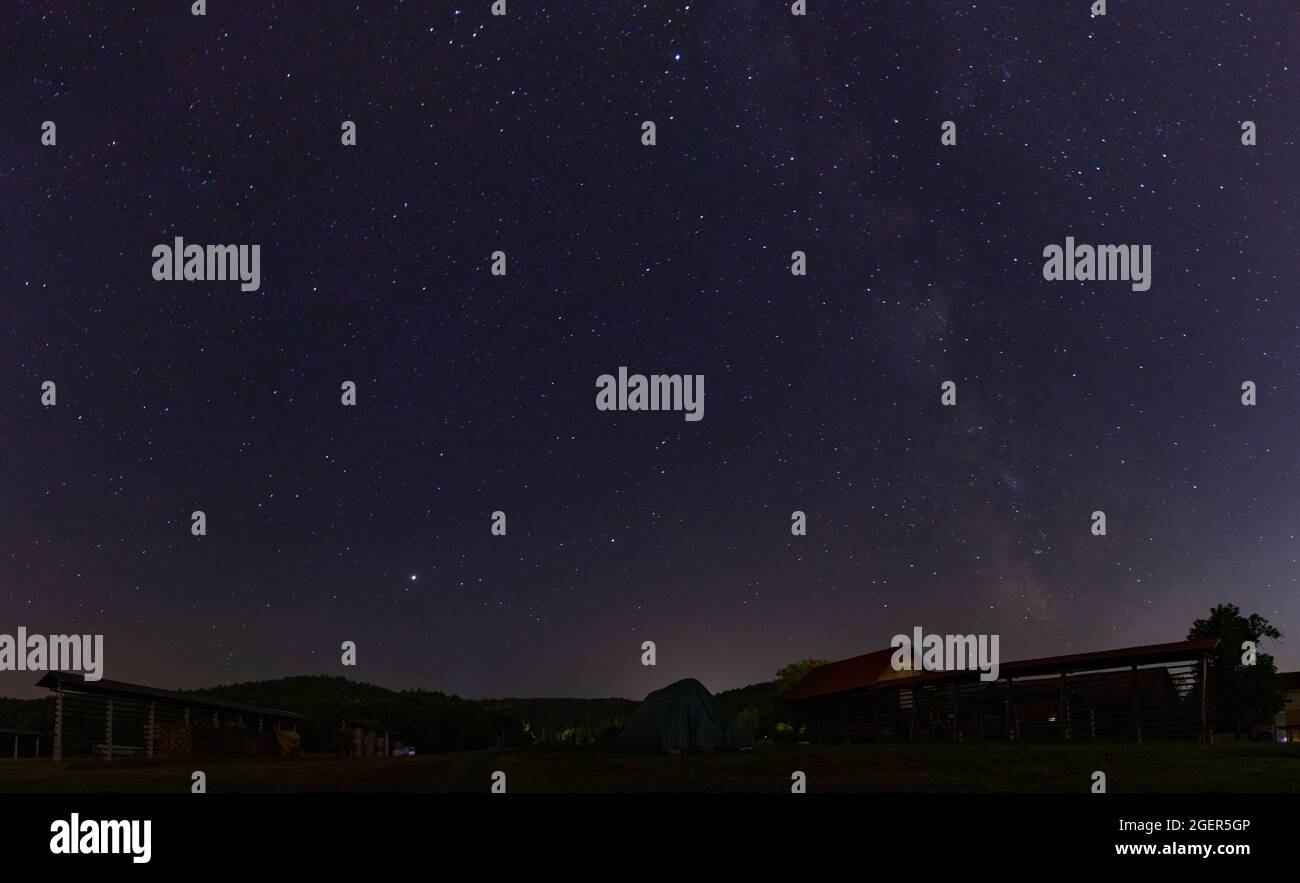A picture of the starry sky and the milky way taken on the countryside ...