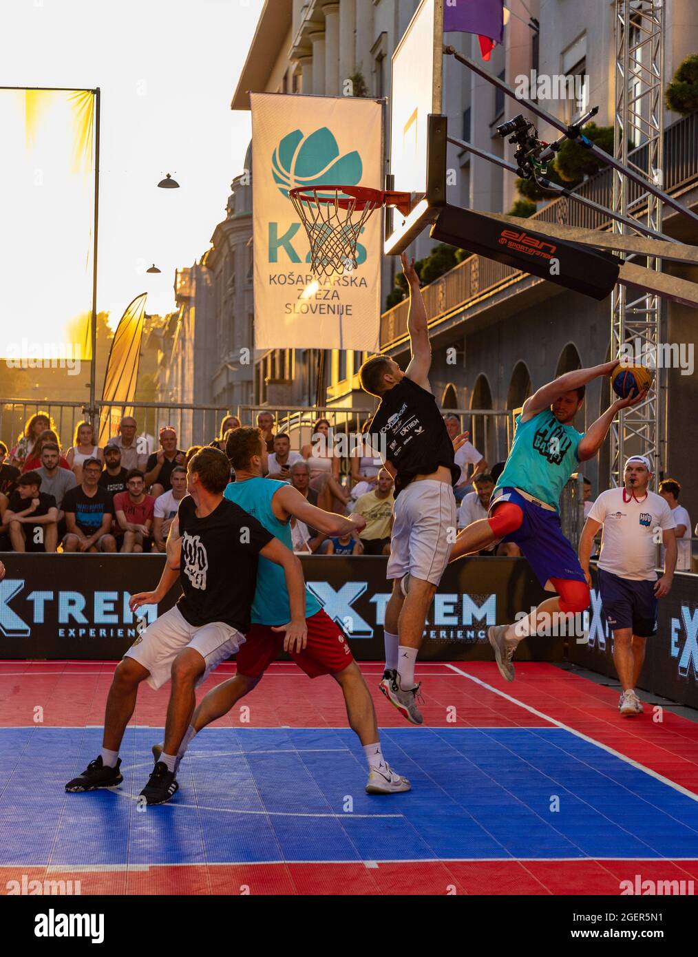 A picture of two teams playing 3x3 basketball on a special event