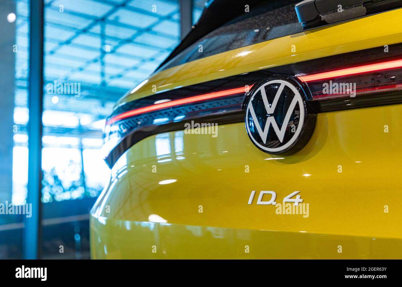 A picture of the back of a yellow Volkswagen ID.4. Stock Photo