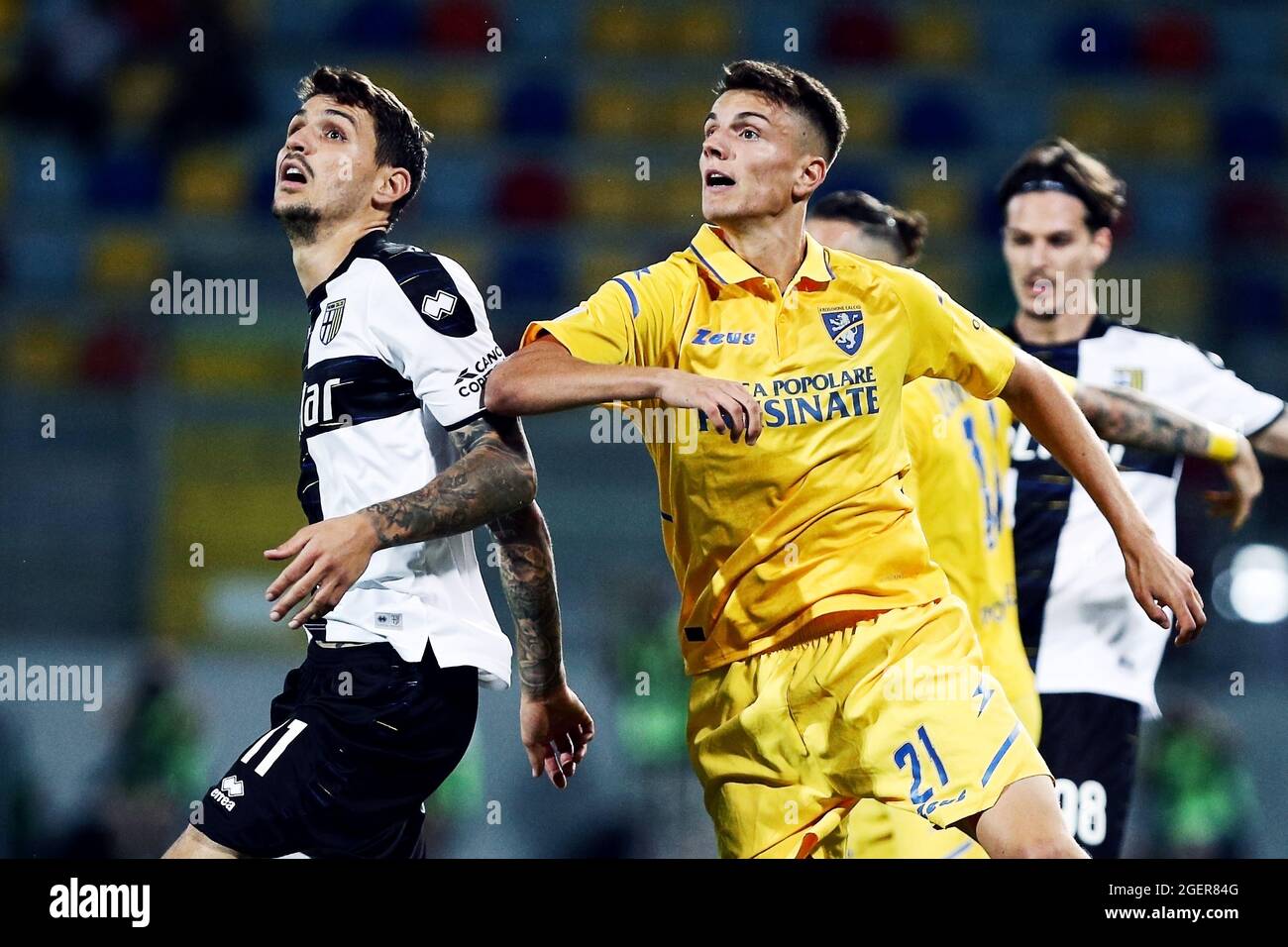 Frosinone, Italy. 20th Aug, 2021. Stanko Juric of Parma (L) fights for the  ball with Daniel Boloca of Frosinone (R) during the Italian championship  Serie B BKT football match between Frosinone Calcio