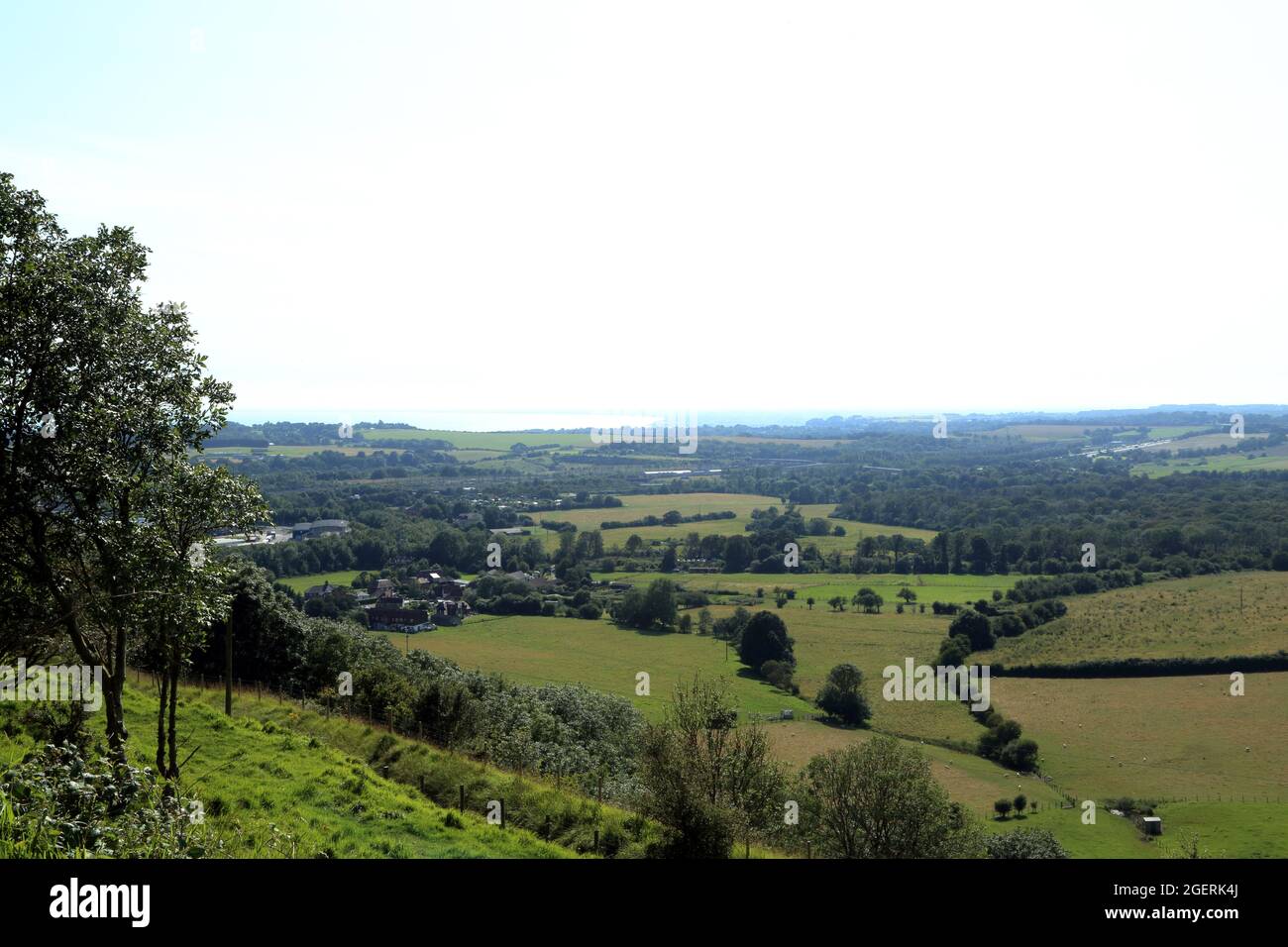 View from North Downs Way / Pilgrims Way towards the coast from North Downs above Peene, Folkestone, Kent, England, United Kingdom Stock Photo