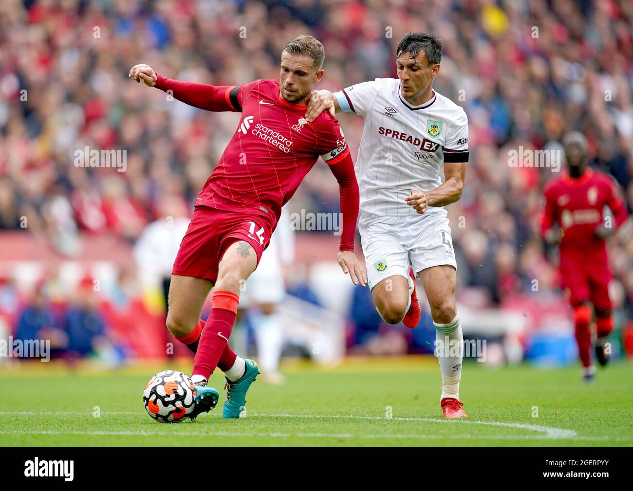 Liverpool's Jordan Henderson (left) and Burnley's Jack Cork battle for the  ball during the Premier League match at Anfield, Liverpool. Picture date:  Saturday August 21, 2021 Stock Photo - Alamy