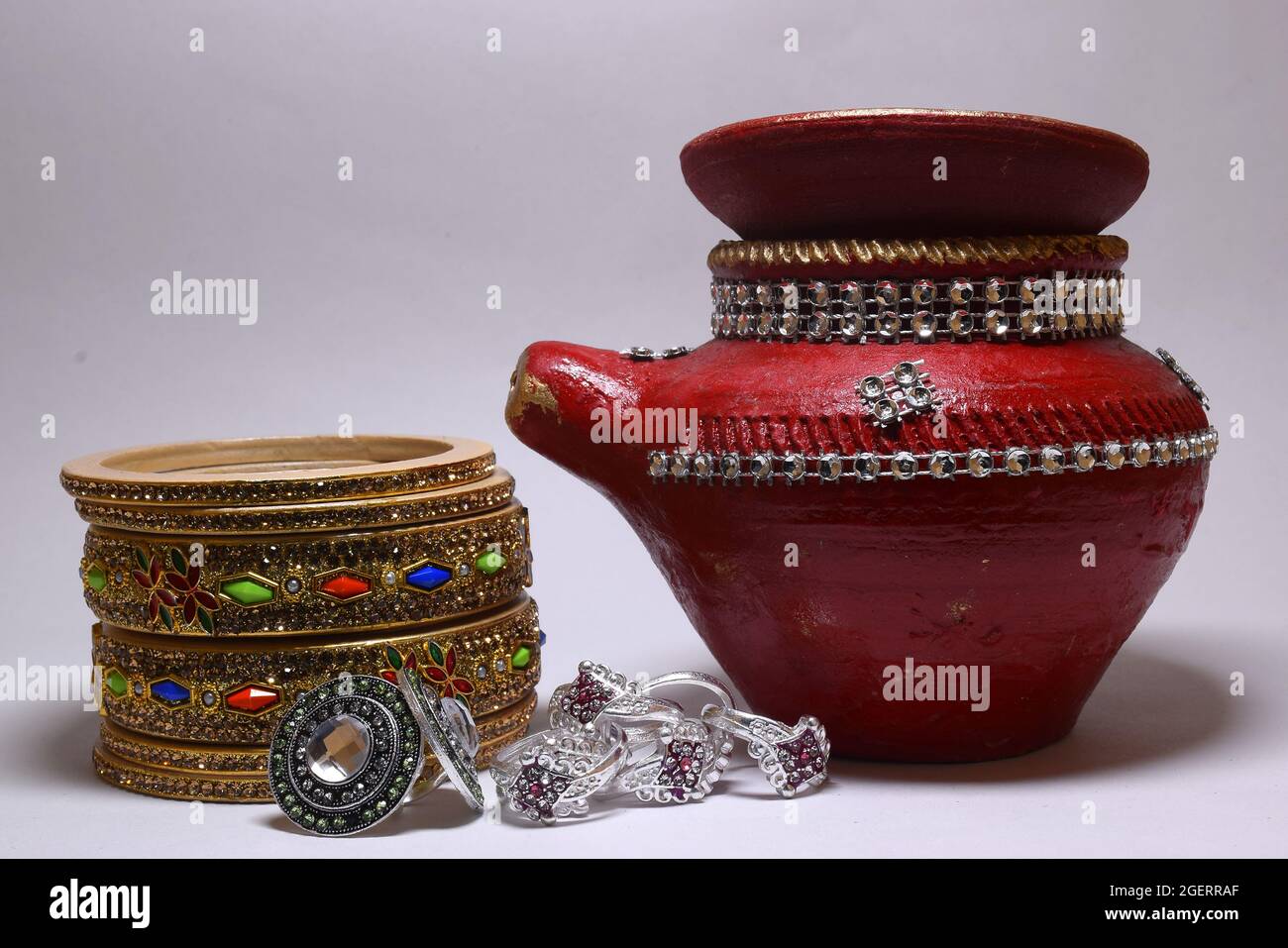 Bangle, nettle and beautiful pot made of clay for indian festival Karva Chauth. Stock Photo