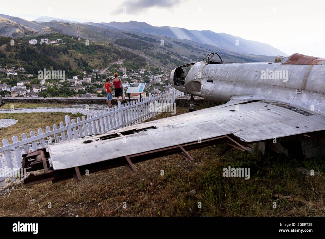 Mother and son standing by American military plane at the castle of Gjirokaster, Albania Stock Photo