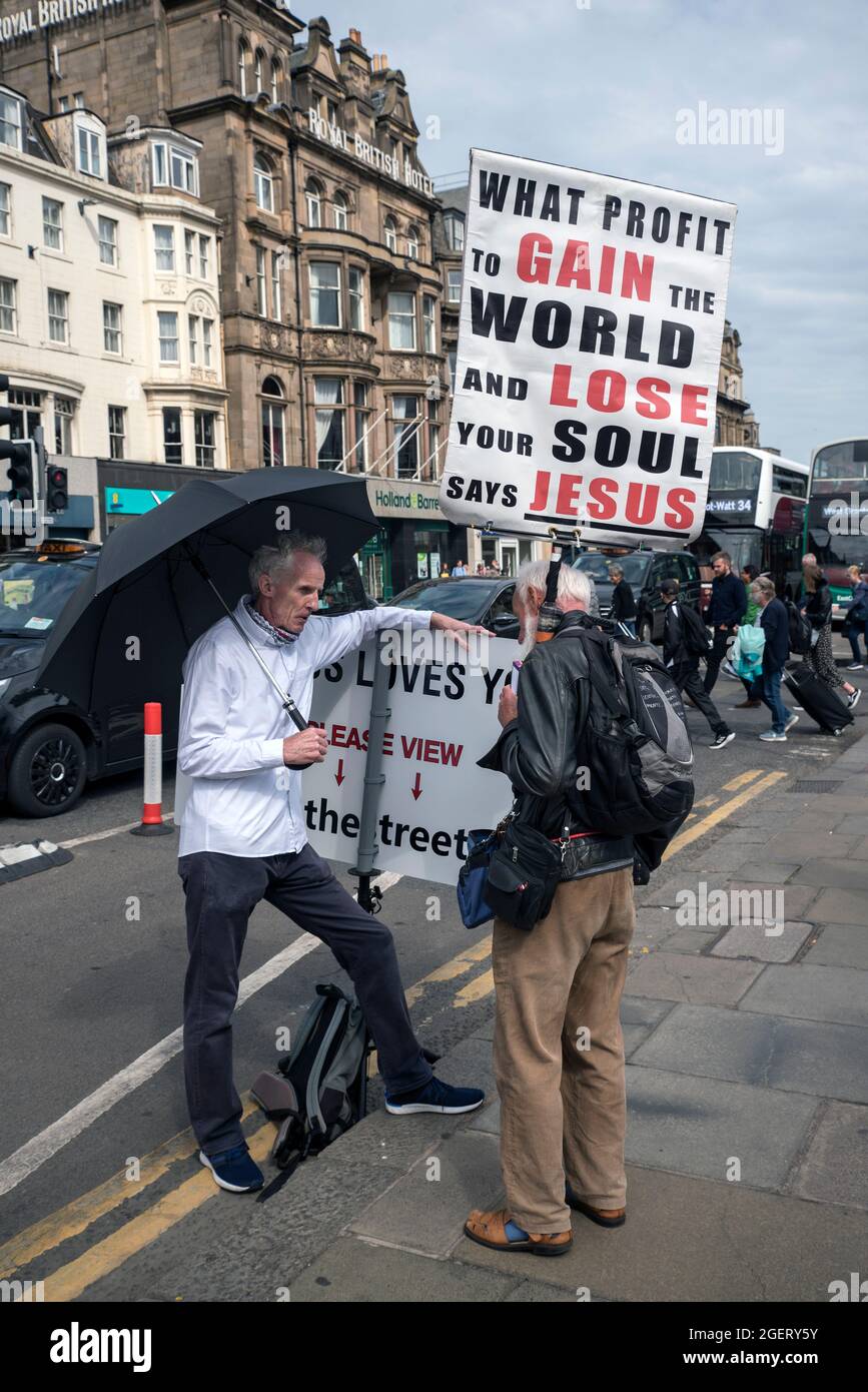 Street preachers in conversation on Princes Street, Edinburgh, Scotland, UK. Stock Photo